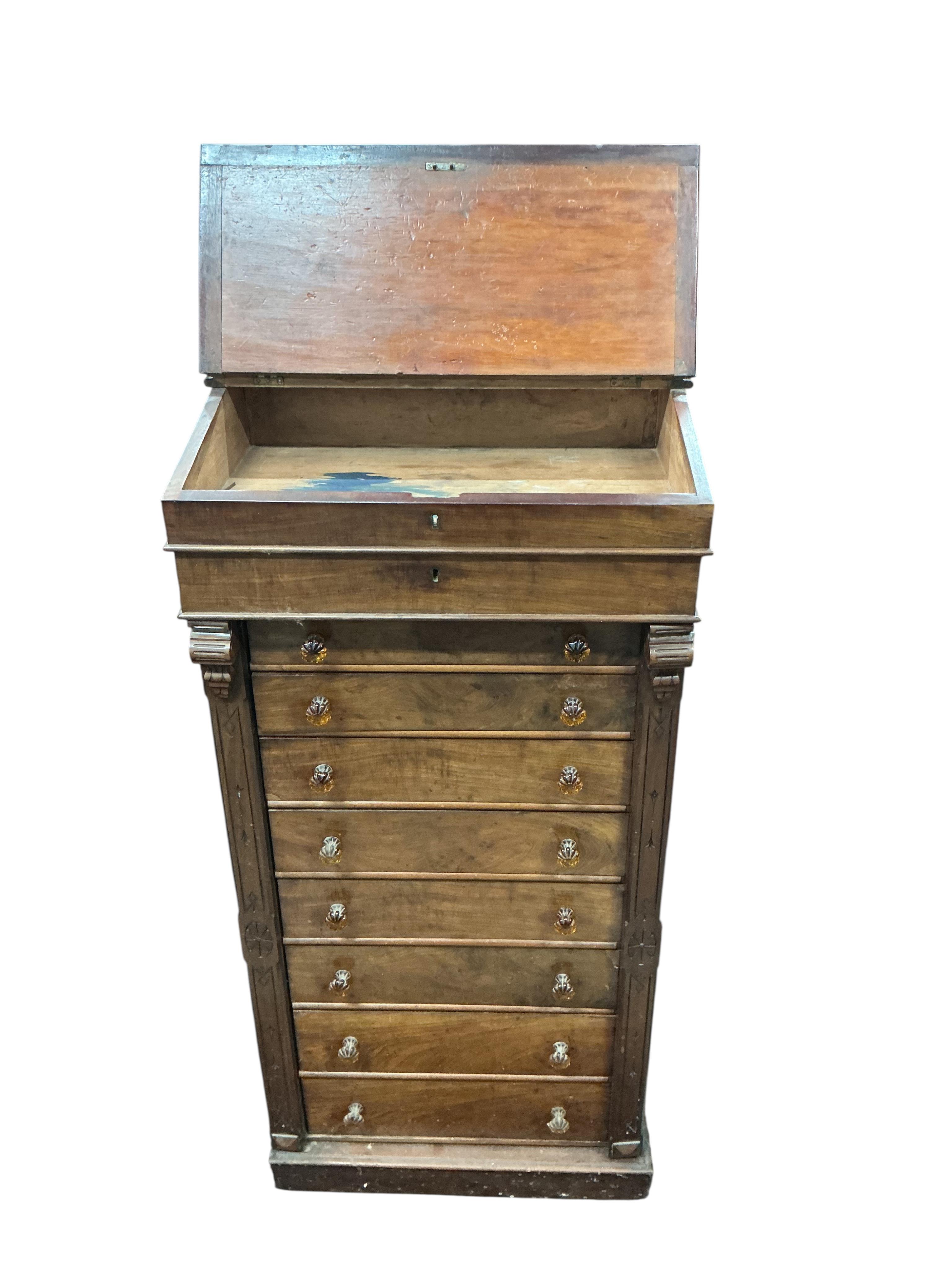 A Victorian mahogany Wellington chest, with writing slope superstructure, width 63cm, depth 40cm, height 130cm